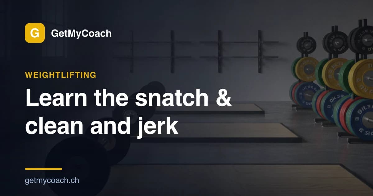 A weightlifter locking out a barbell overhead in a deep receiving squat on a lifting platform, chalk dust in the air — GetMyCoach cover graphic for the beginner's guide to the snatch and clean & jerk.